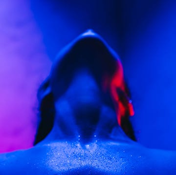 conceptual portrait of woman in neon light. alien, forecasting, artificial intelligence and individuality concept.