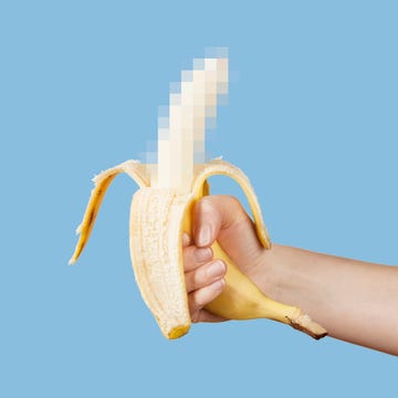 hidden censored banana in hand on a blue background. horny (aroused) penis, male erection and sexual education. funny pornography.